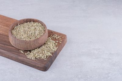 green-anise-seeds-wooden-board-concrete-surface_114579-71065